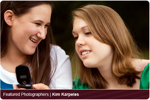 TEN165KK 001 001-White teen girl shows her White teen female friend photo on her camera phone, Riverwoods, IL