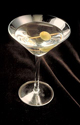 DRU051FM 004 002 -Studio shot of martini with olive on toothpick in martini glass against black background 